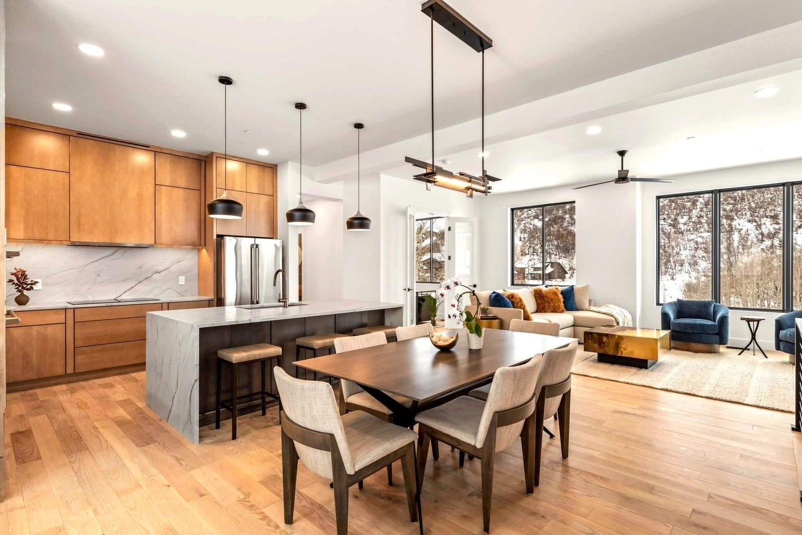 Open kitchen and dining area with warm wood finishes