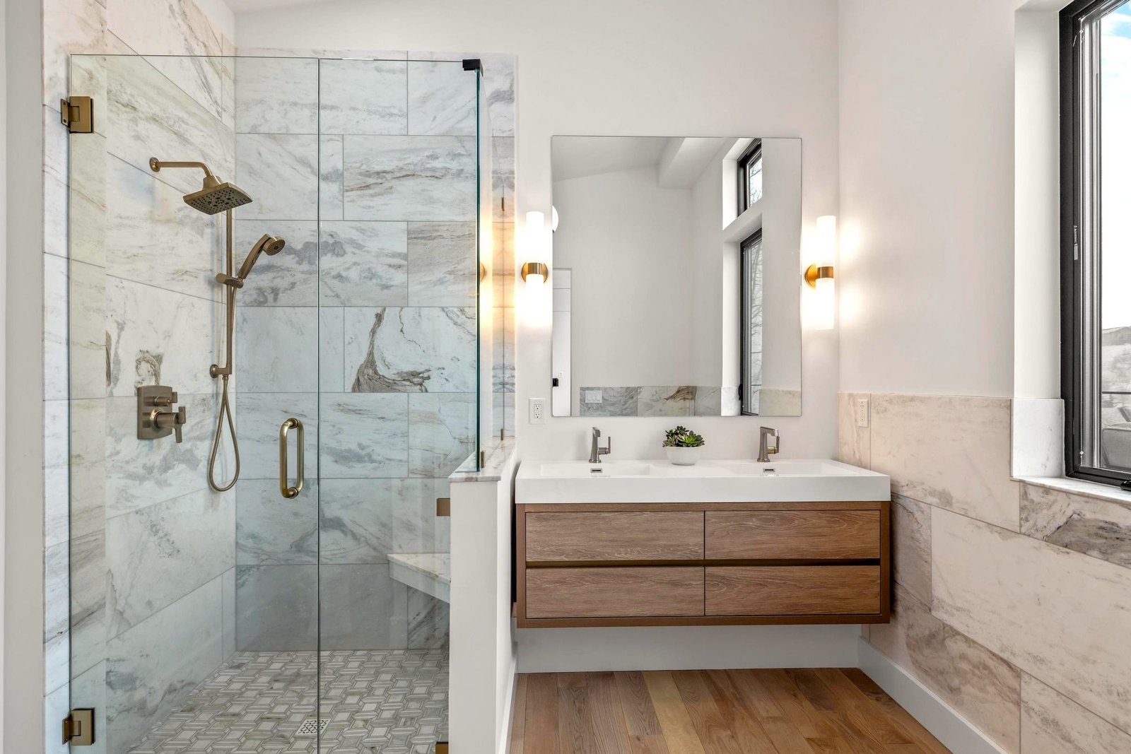 Bathroom vanity with modern fixtures and warm finishes
